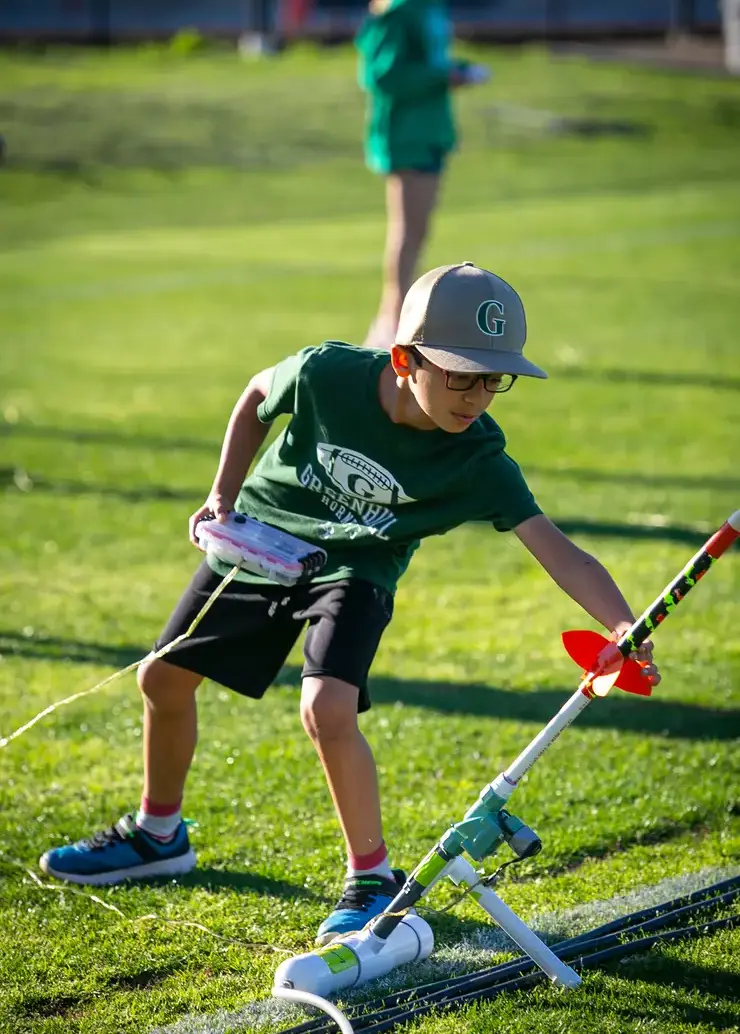 Student setting up his rocket for launch